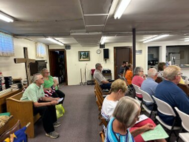 Here we are, gathered downstairs, receiving the Word.