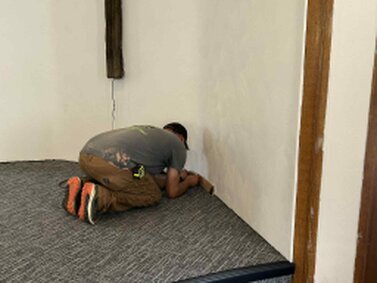 Installing the final pieces of molding.