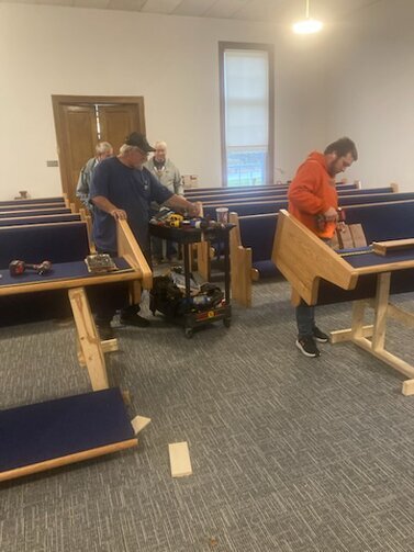 The pews being assembled.<br /><br />These two men really put in a days work
