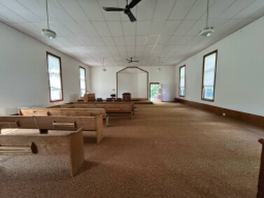 Most of the pews are out, the remaining ones are all on one side.