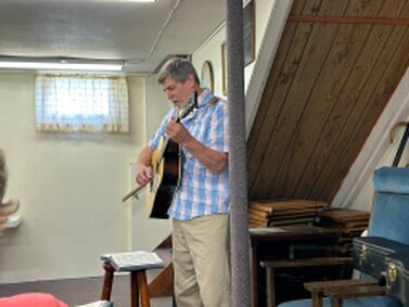 We did have a piano downstairs, so Steve is leading the music with his guitar.