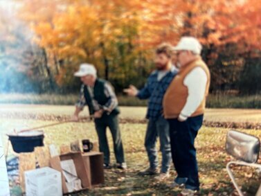 Arnold Schuek, Gene Latourette and John Arnold stirring a pot of apple butter.<br />Apple butter was an annual tradition at North Richmond.